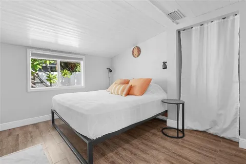 a view of a dining room with furniture and window