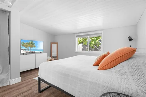 a backyard of a house with barbeque oven table and chairs