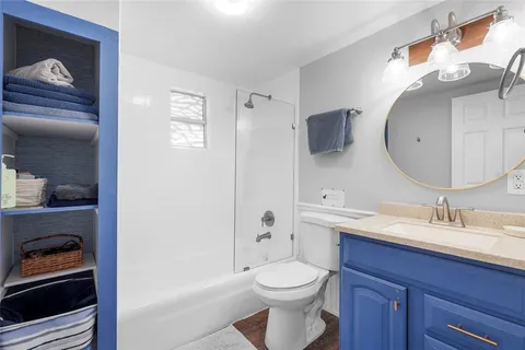 a view of a backyard with plants and a tree