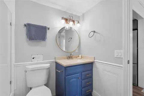 an aerial view of residential houses with outdoor space and parking