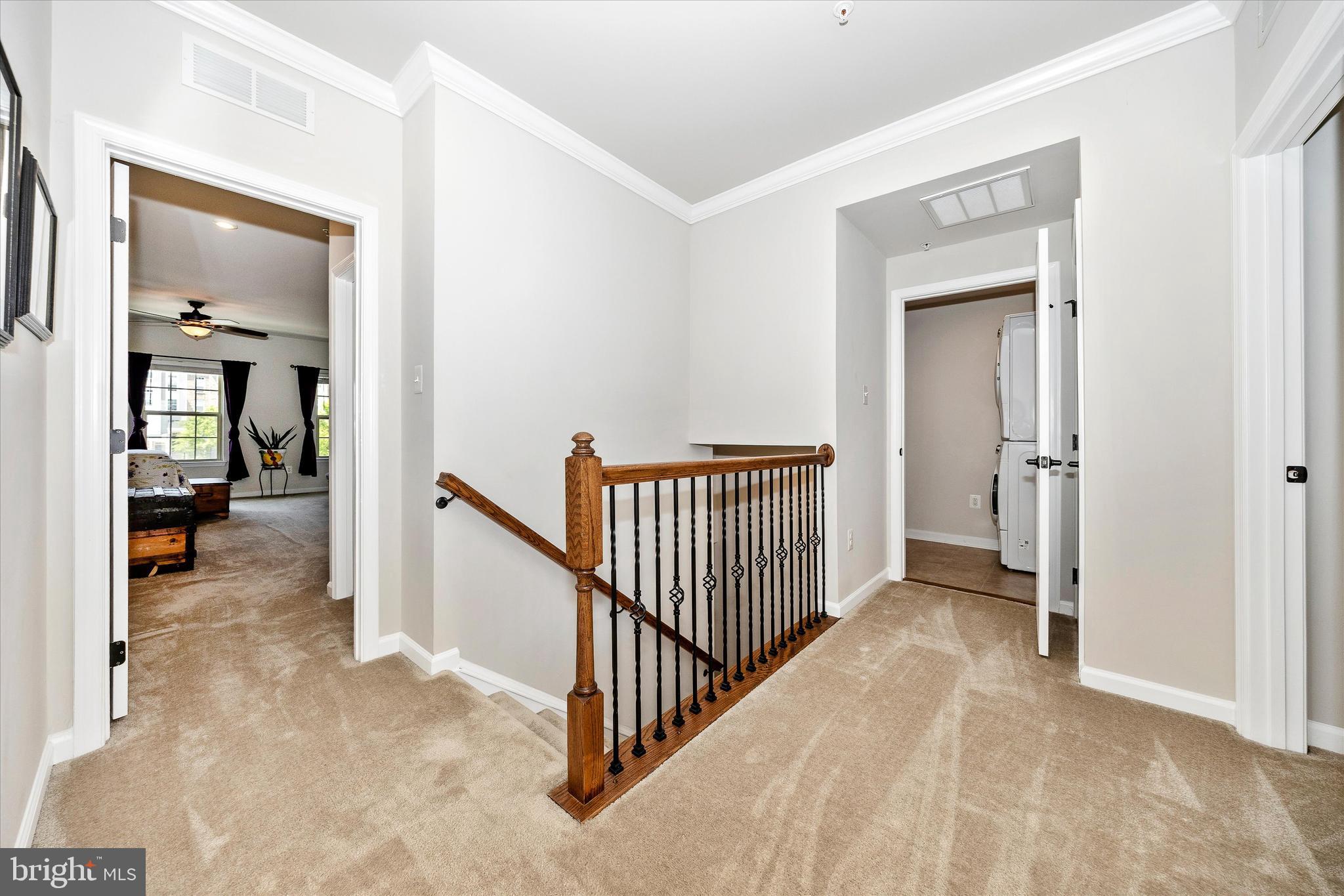 6032 Forum Square Frederick, MD 21703 - Photo 15 of 40 Open landing area peeking into laundry room