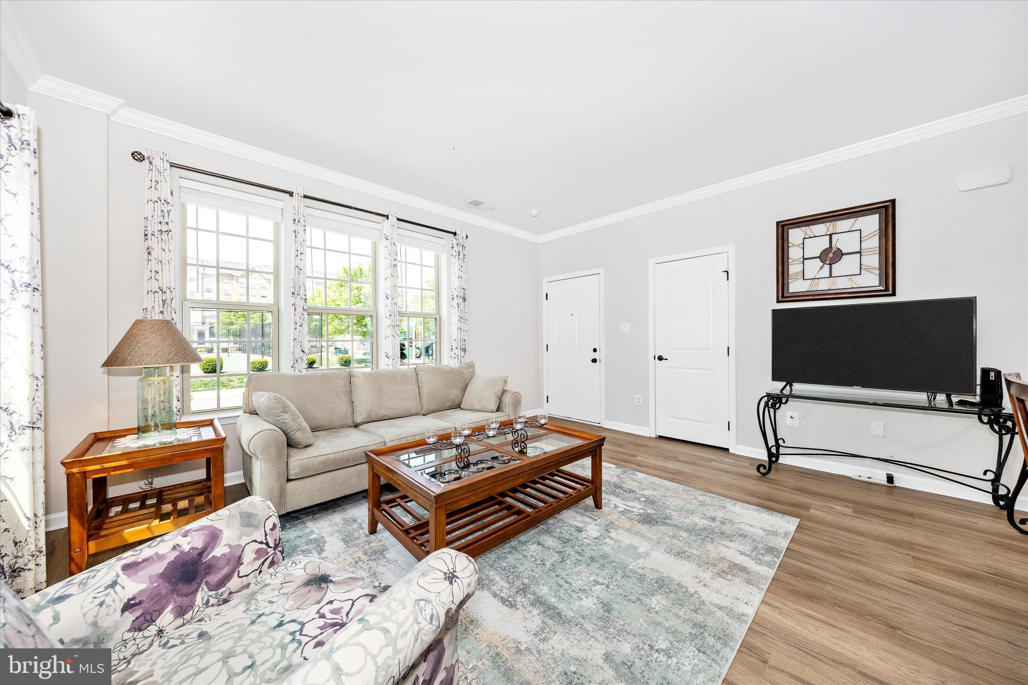 6032 Forum Square Frederick, MD 21703 - Photo 6 of 40 Bright, open living room with LVP flooring