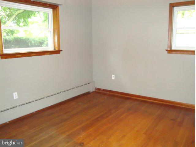 5984 Grove Hill Road Frederick, MD 21703 - Photo 22 of 30 Master Bedroom With Hardwood Floor