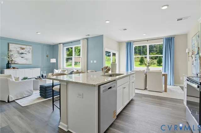 a large kitchen with kitchen island granite countertop a large counter top and sink