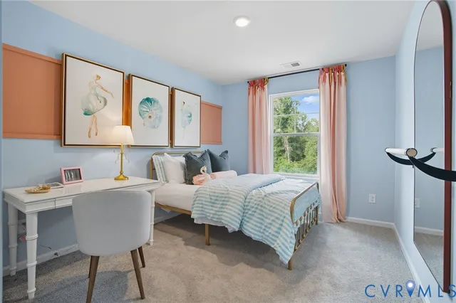 a bedroom with furniture and a window