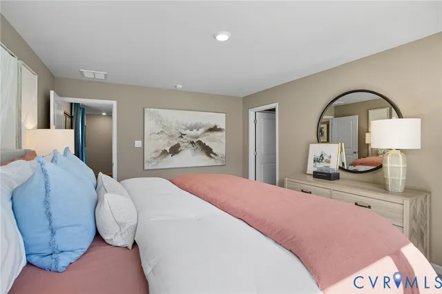 a bedroom with a bed and glass windows