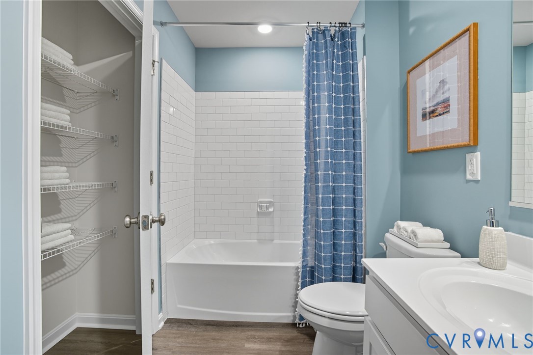 7725 Arbor Marsh Terrace New Kent, VA 23124 - Photo 24 of 27 a white toilet sitting next to a bathroom sink