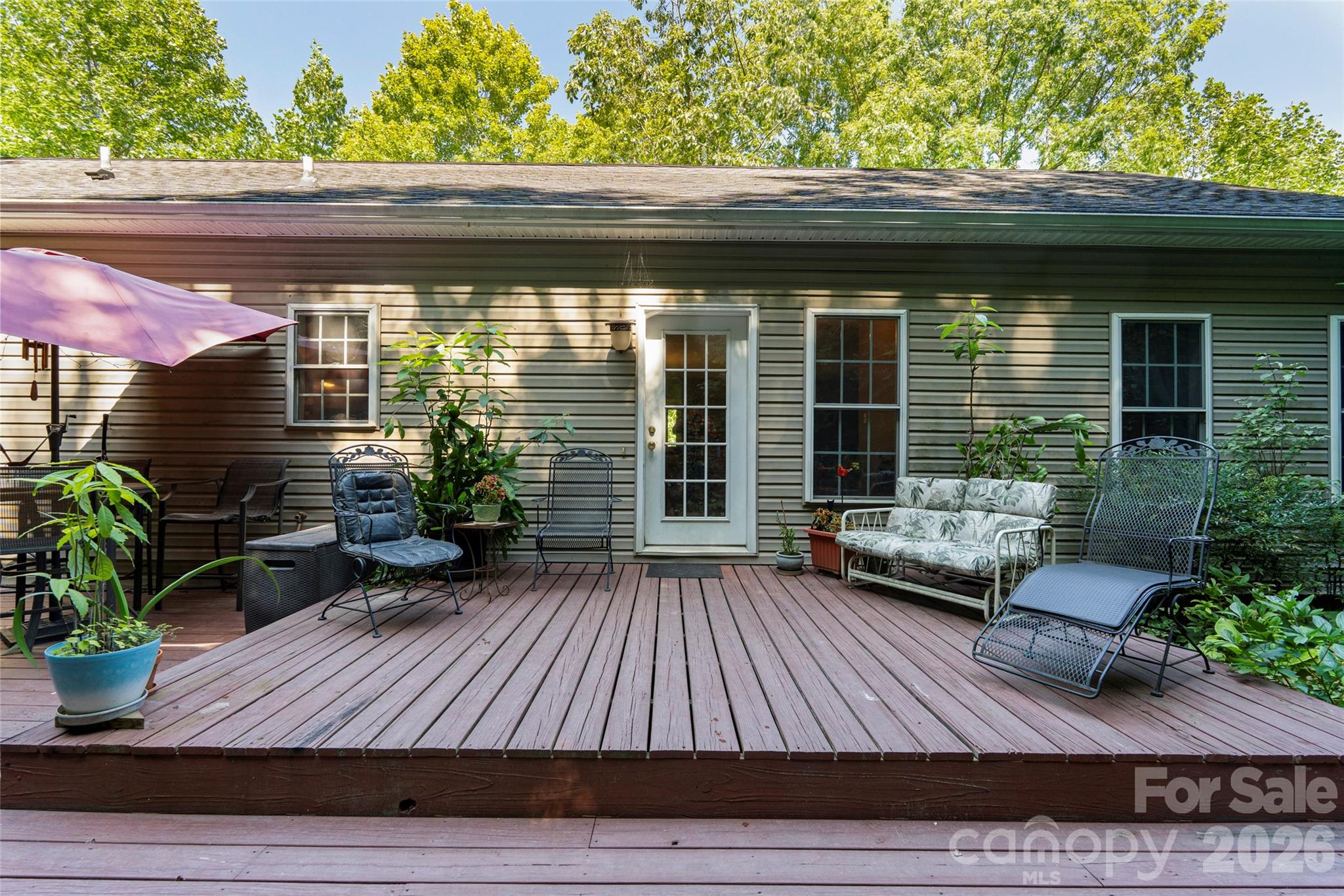 319 Glenn Bridge Road, Unit 24 Arden, NC 28704 - Photo 1 of 37 a view of house with deck outdoor seating and covered with furniture
