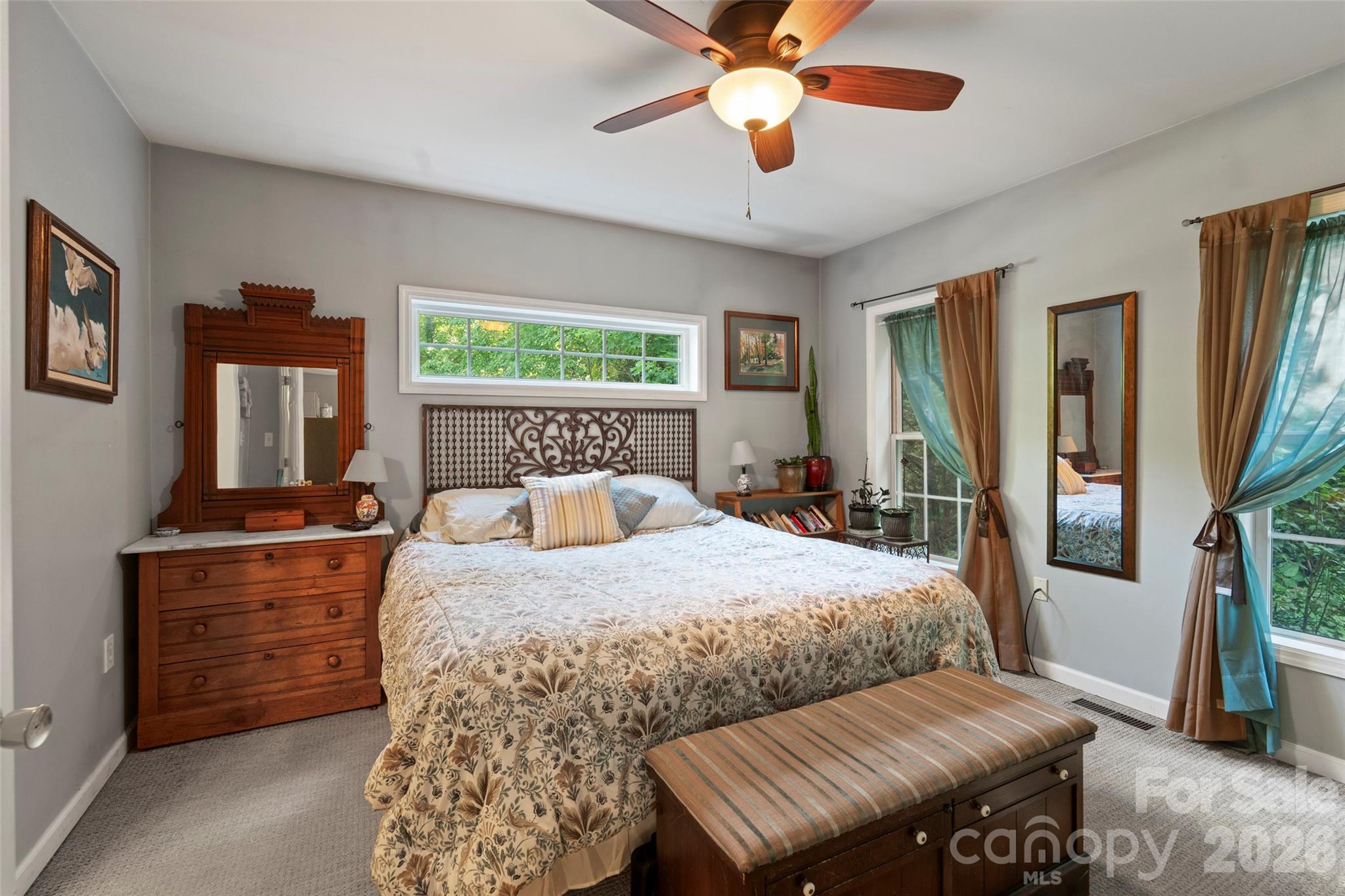 319 Glenn Bridge Road, Unit 24 Arden, NC 28704 - Photo 12 of 37 a bedroom with a bed and a chandelier