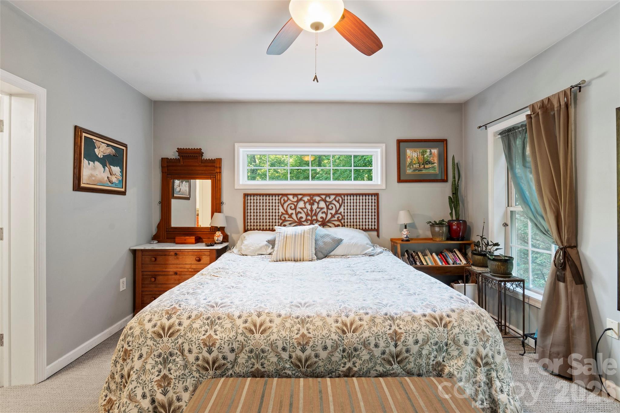 319 Glenn Bridge Road, Unit 24 Arden, NC 28704 - Photo 13 of 37 a bedroom with a large bed and a flat tv screen