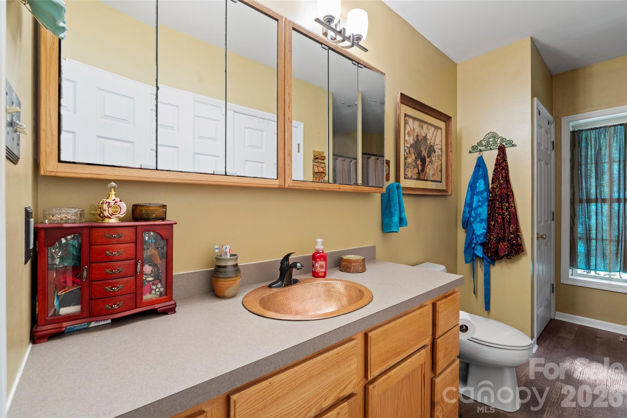 319 Glenn Bridge Road, Unit 24 Arden, NC 28704 - Photo 20 of 37 a bathroom with a sink and a toilet