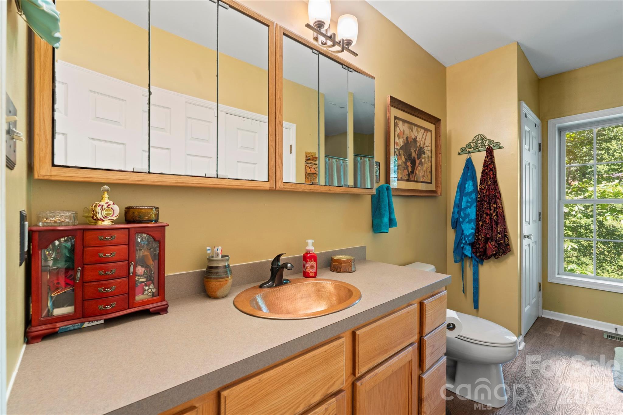 319 Glenn Bridge Road, Unit 24 Arden, NC 28704 - Photo 22 of 37 a bathroom with a sink and a toilet
