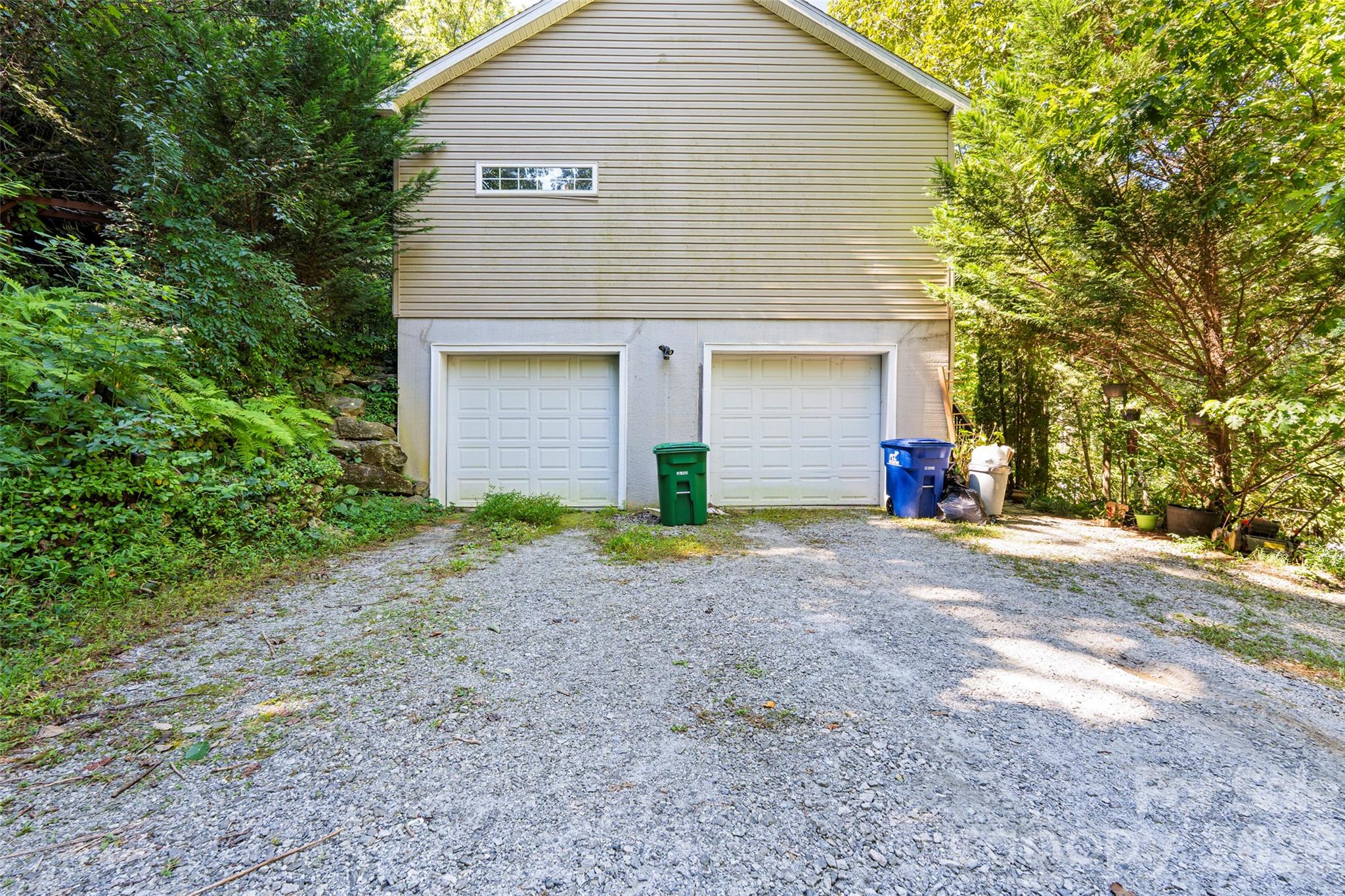 319 Glenn Bridge Road, Unit 24 Arden, NC 28704 - Photo 30 of 37 a view of a house with a yard and garage
