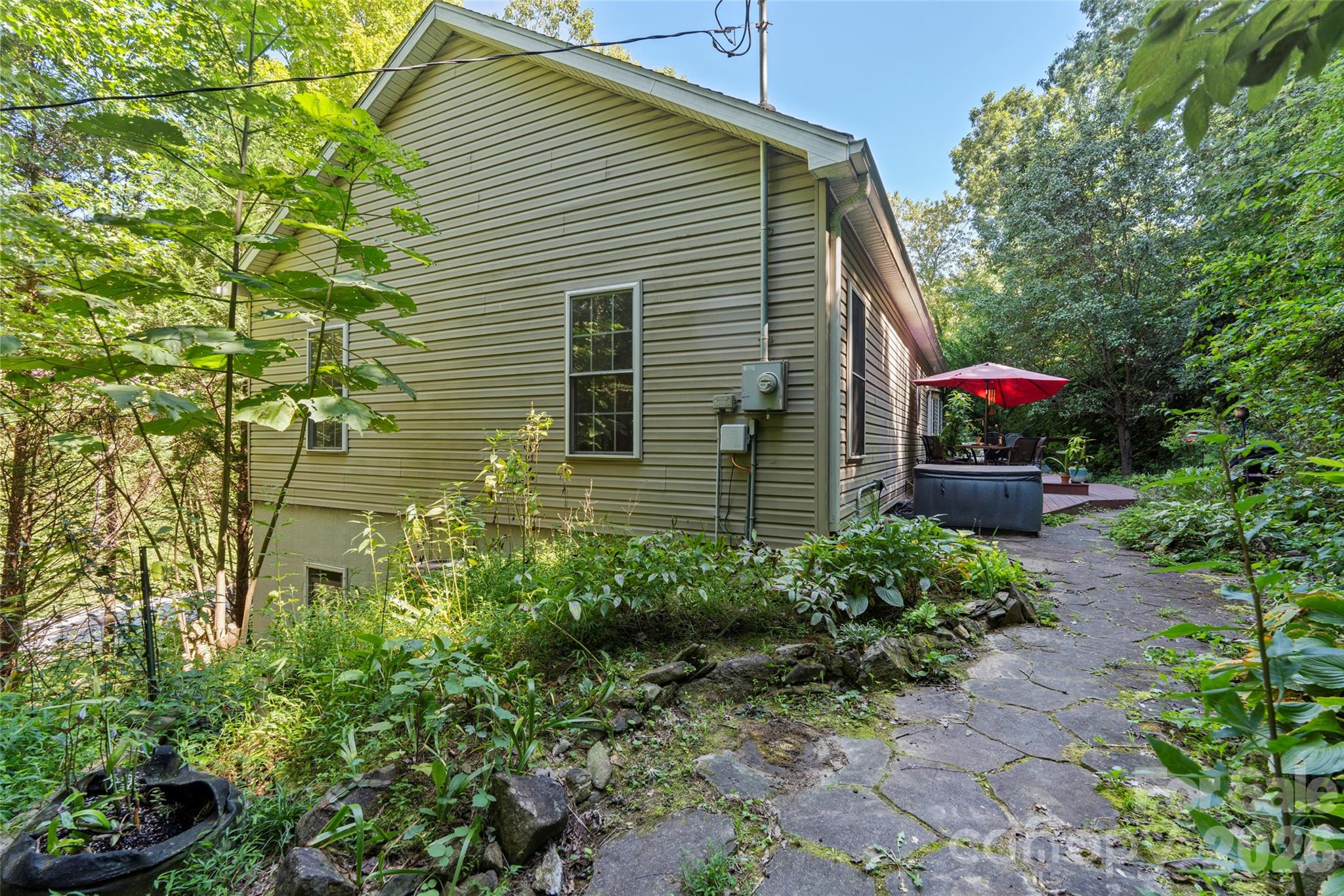 319 Glenn Bridge Road, Unit 24 Arden, NC 28704 - Photo 33 of 37 a view of a house with a backyard