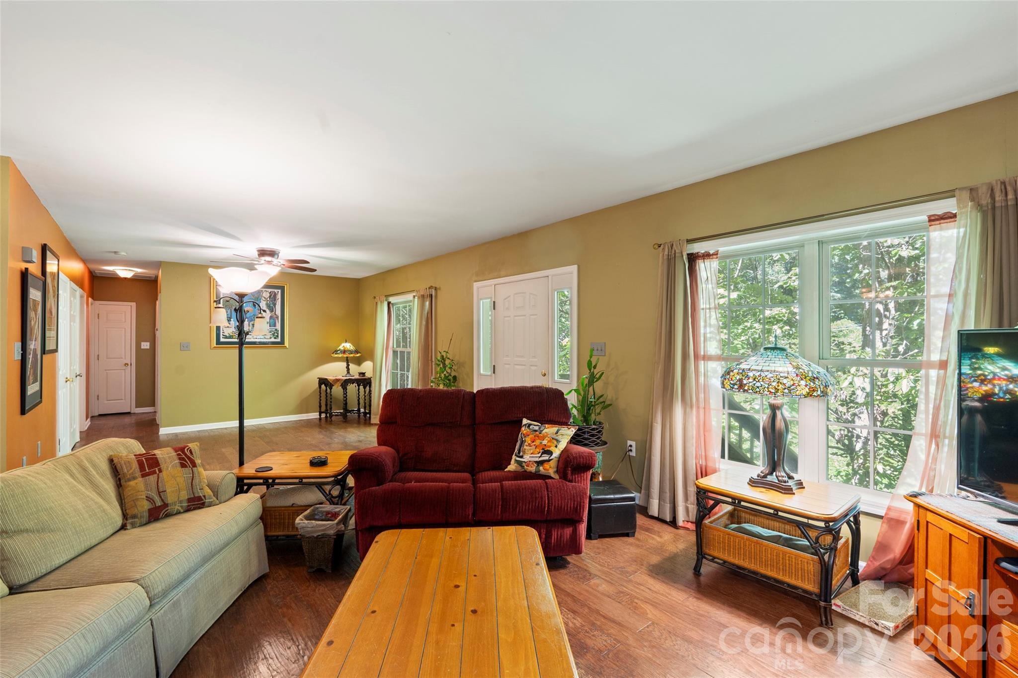 319 Glenn Bridge Road, Unit 24 Arden, NC 28704 - Photo 5 of 37 a living room with furniture and a large window