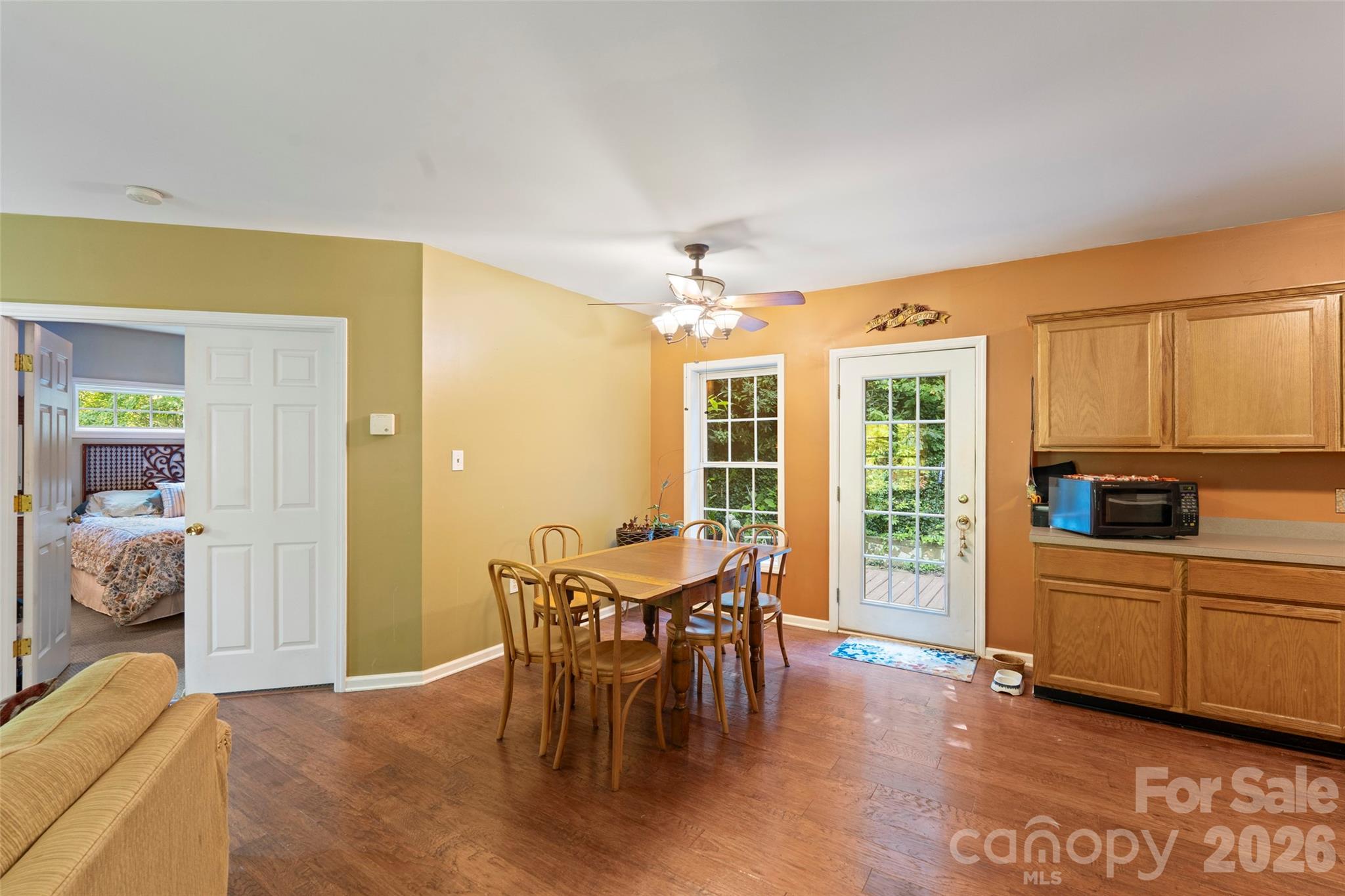 319 Glenn Bridge Road, Unit 24 Arden, NC 28704 - Photo 7 of 37 a view of a dining room with furniture window and wooden floor