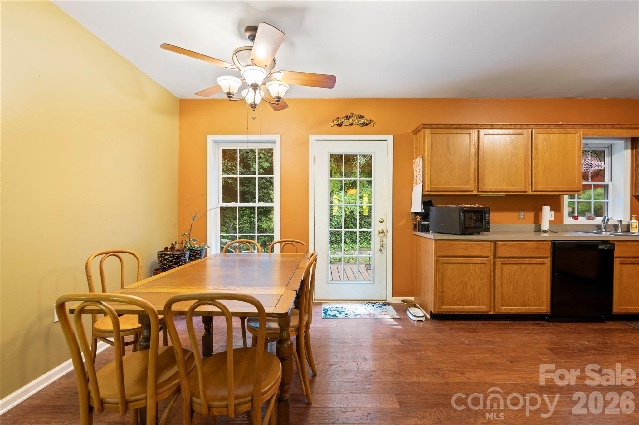 319 Glenn Bridge Road, Unit 24 Arden, NC 28704 - Photo 8 of 37 a view of a dining room with furniture window and wooden floor