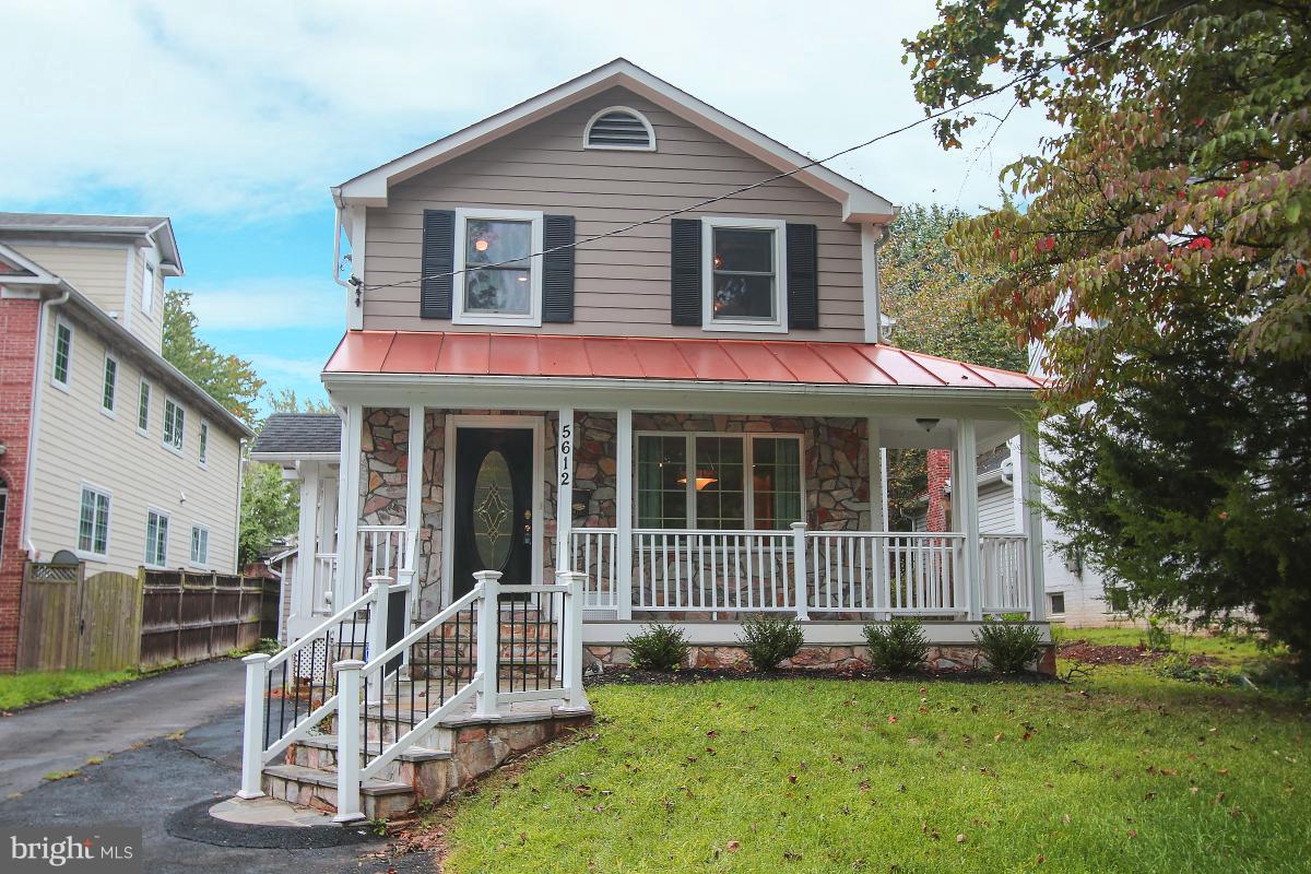 5612 Greentree Road Bethesda, MD 20817 - Photo 1 of 28 a front view of a house with a yard