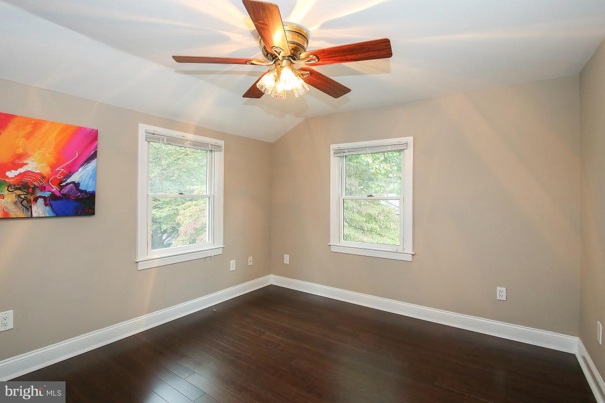 5612 Greentree Road Bethesda, MD 20817 - Photo 17 of 28 a view of an empty room with wooden floor and a window
