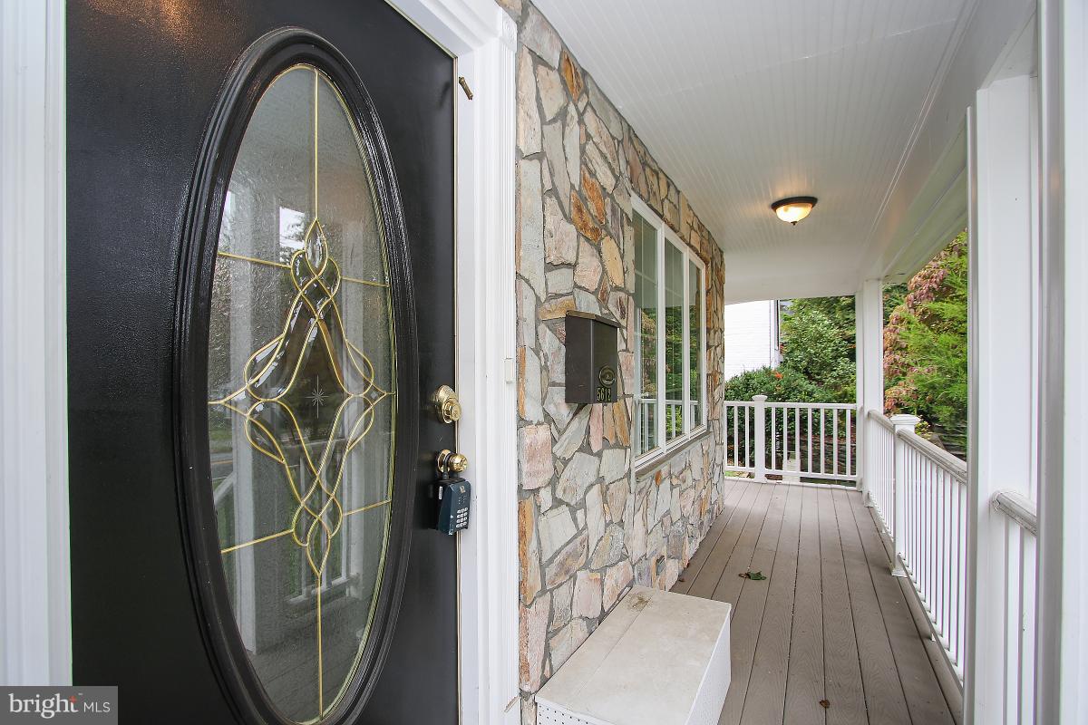 5612 Greentree Road Bethesda, MD 20817 - Photo 3 of 28 a view of a entryway door with wooden floor