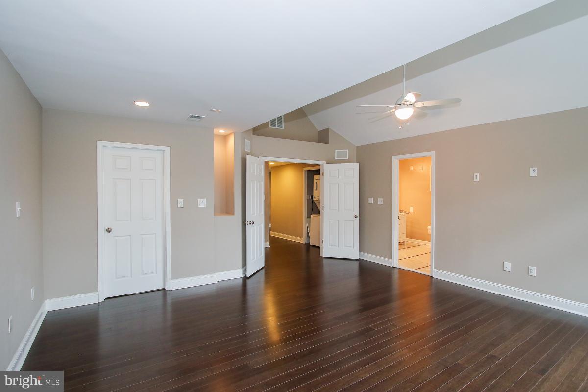 5612 Greentree Road Bethesda, MD 20817 - Photo 22 of 28 a view of an empty room with wooden floor and a window