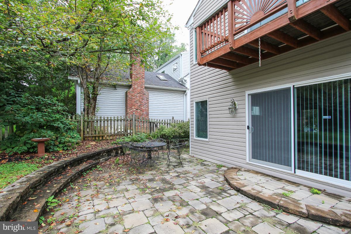 5612 Greentree Road Bethesda, MD 20817 - Photo 27 of 28 a wooden bench sitting in front of a house