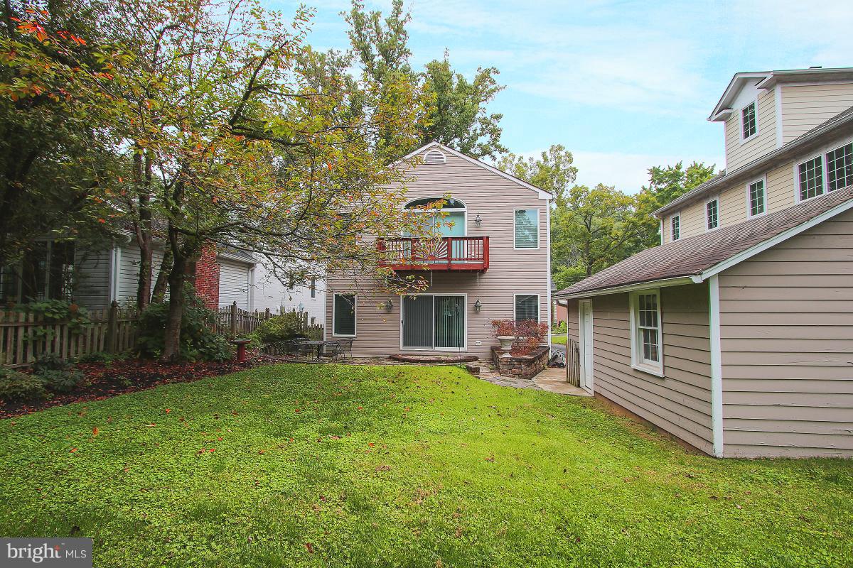 5612 Greentree Road Bethesda, MD 20817 - Photo 28 of 28 a front view of a house with a garden and trees
