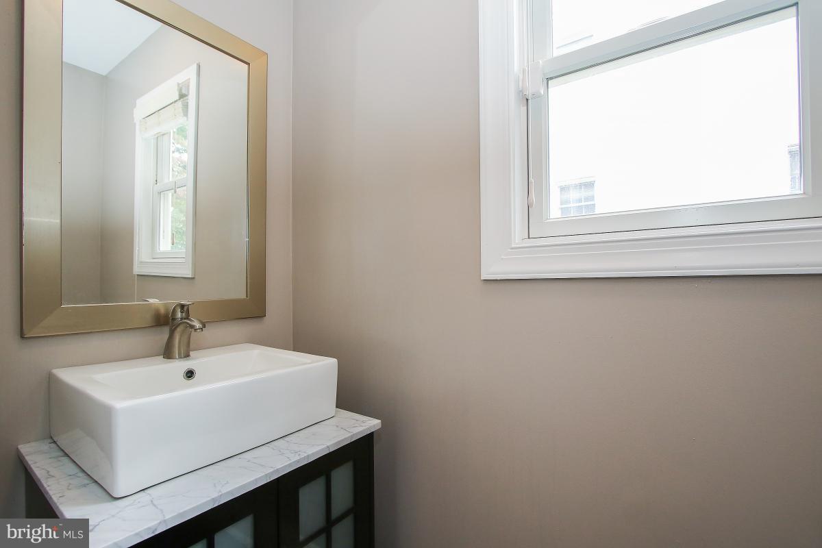 5612 Greentree Road Bethesda, MD 20817 - Photo 7 of 28 a white bath tub sitting next to a white sink