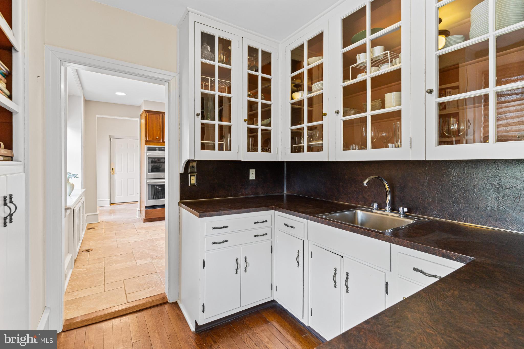 764 Glen Road Jenkintown, PA 19046 - Photo 15 of 57 a kitchen with granite countertop a sink and cabinets