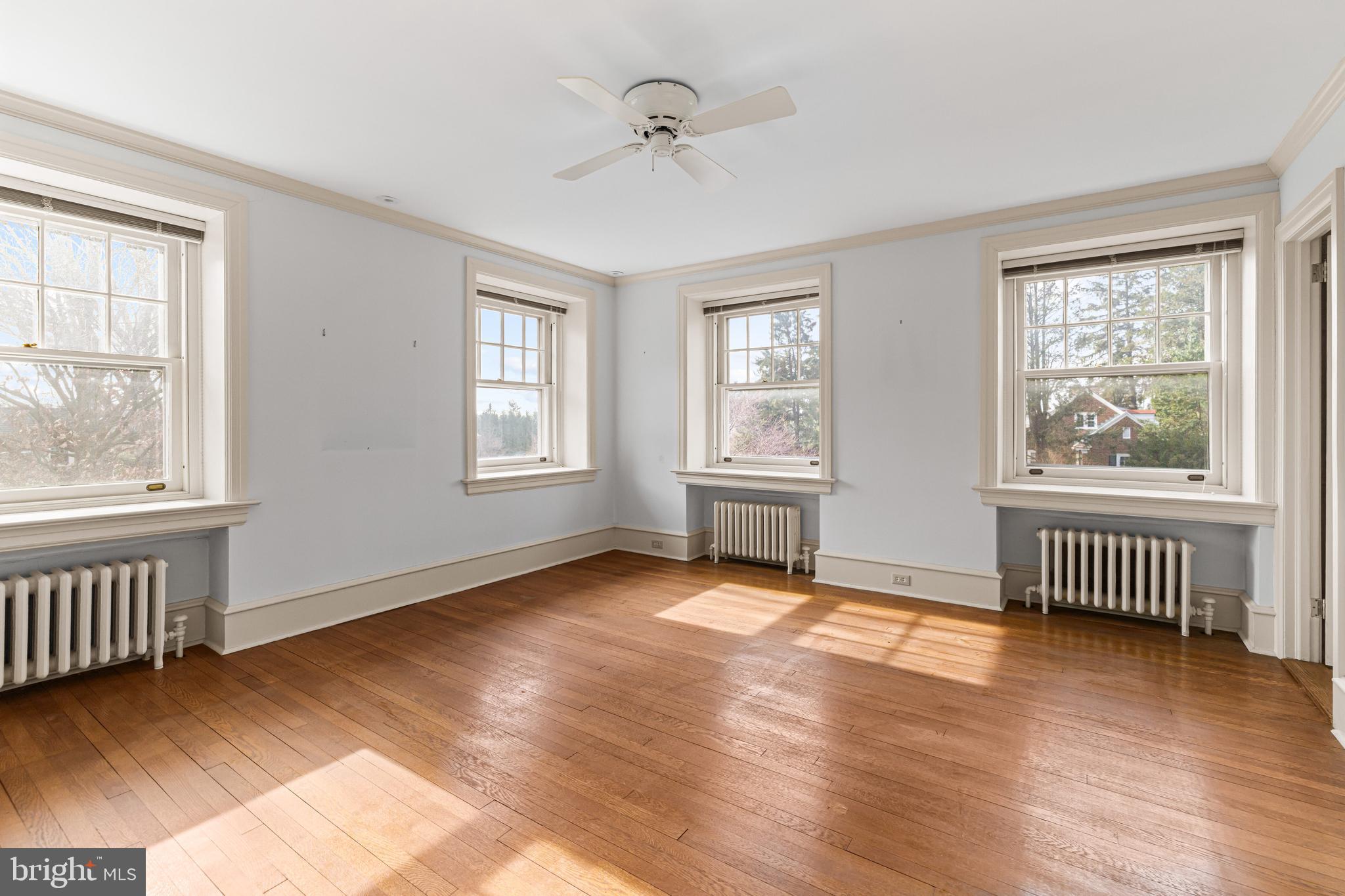 764 Glen Road Jenkintown, PA 19046 - Photo 27 of 57 a view of an empty room with a window and wooden floor