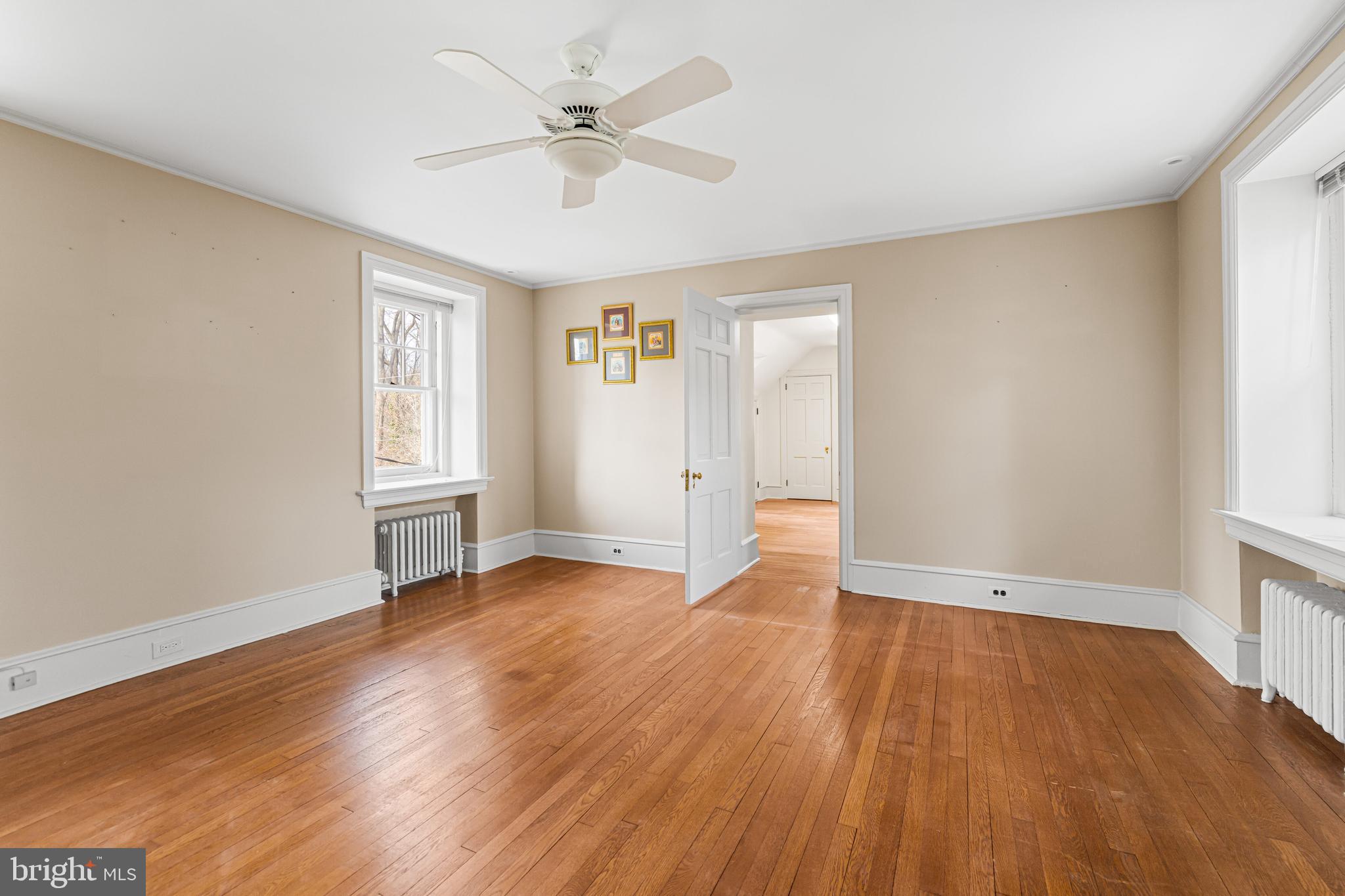 764 Glen Road Jenkintown, PA 19046 - Photo 30 of 57 an empty room with wooden floor and windows