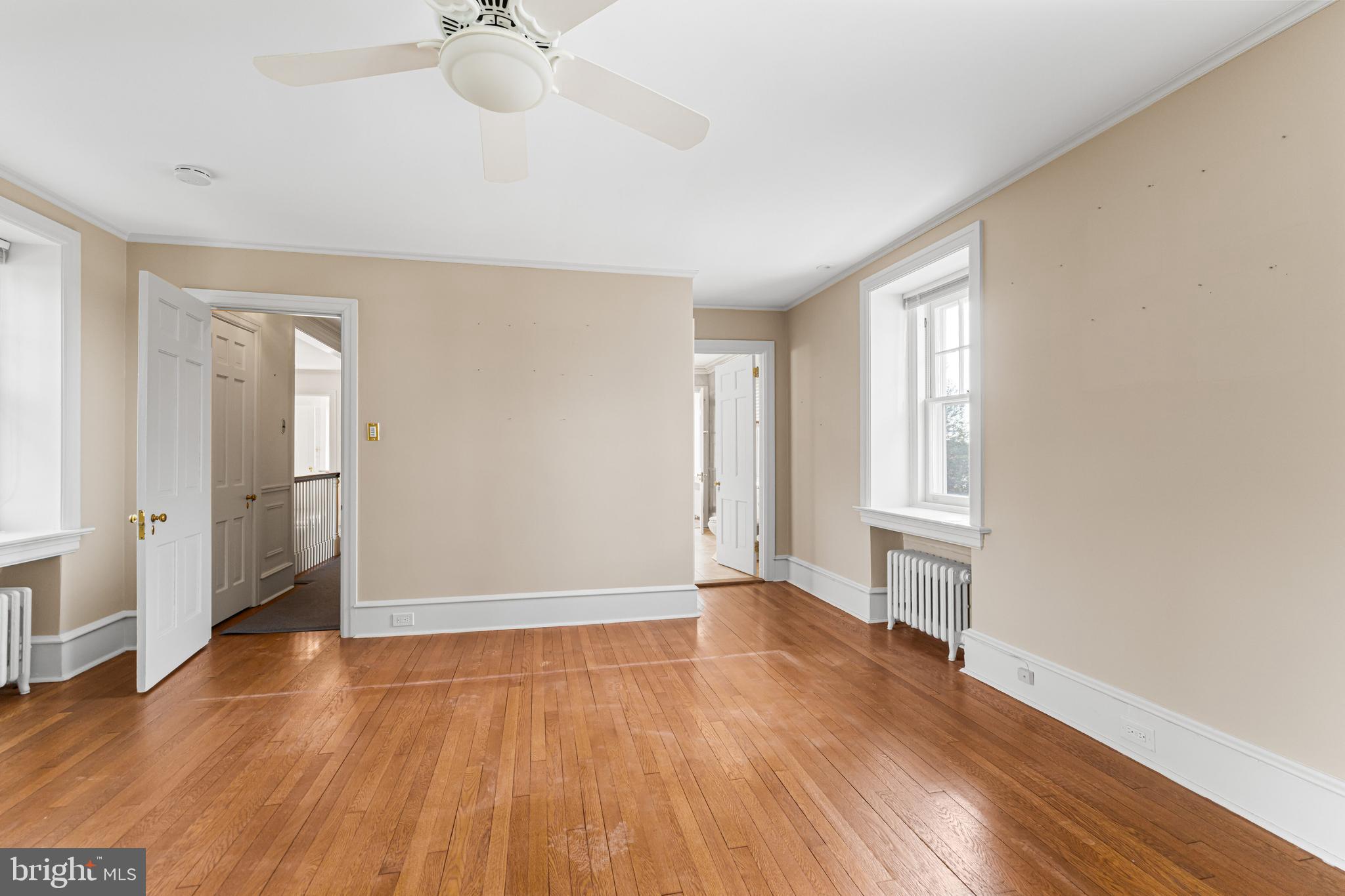 764 Glen Road Jenkintown, PA 19046 - Photo 31 of 57 a view of an empty room with window and wooden floor