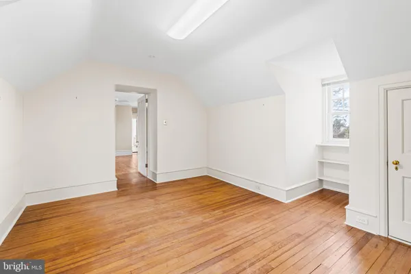 a bedroom with bed and window