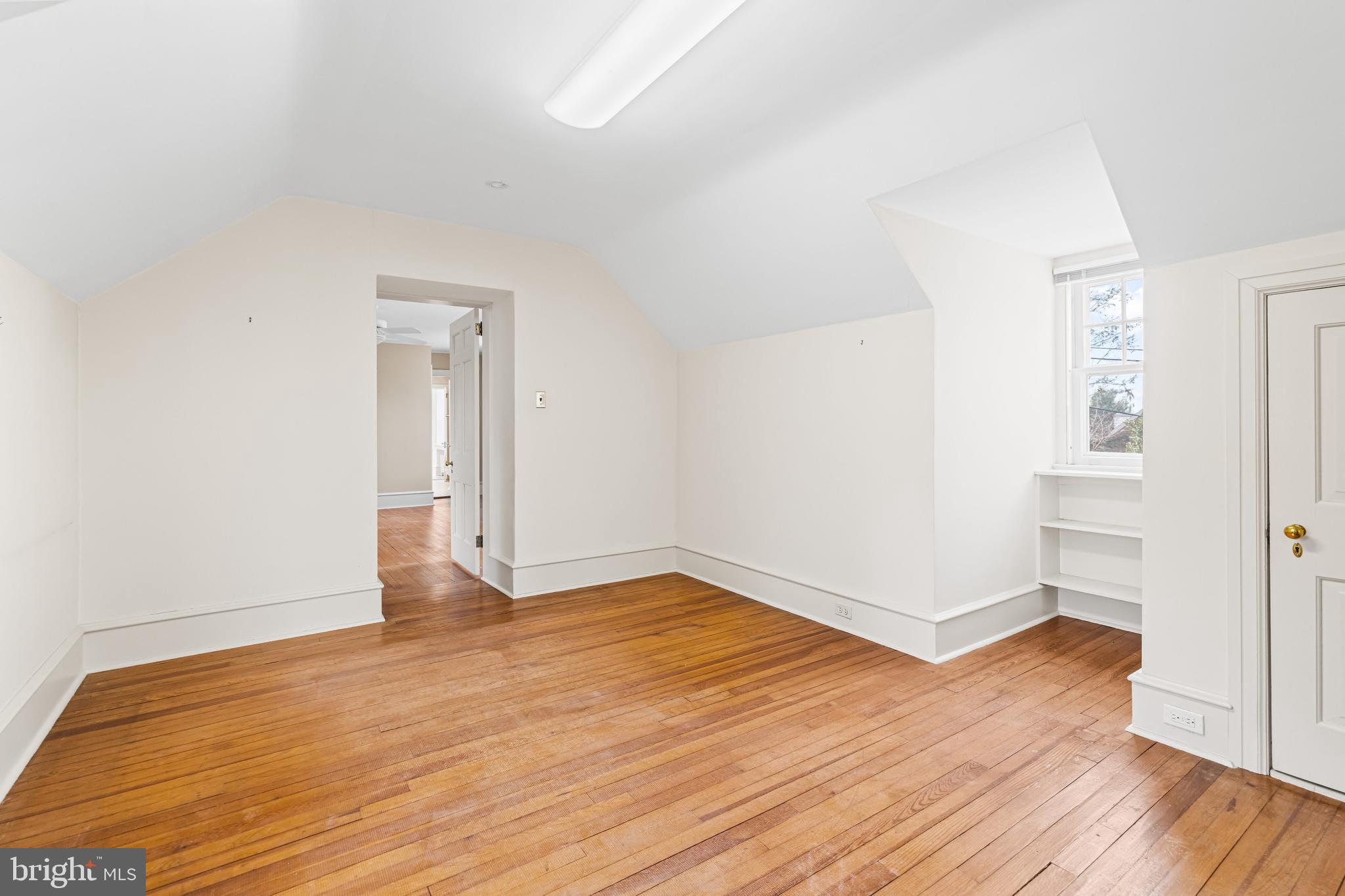 764 Glen Road Jenkintown, PA 19046 - Photo 32 of 57 an empty room with wooden floor & windows
