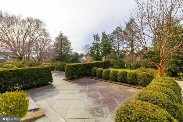 an aerial view of a house with a yard basket ball court and outdoor seating