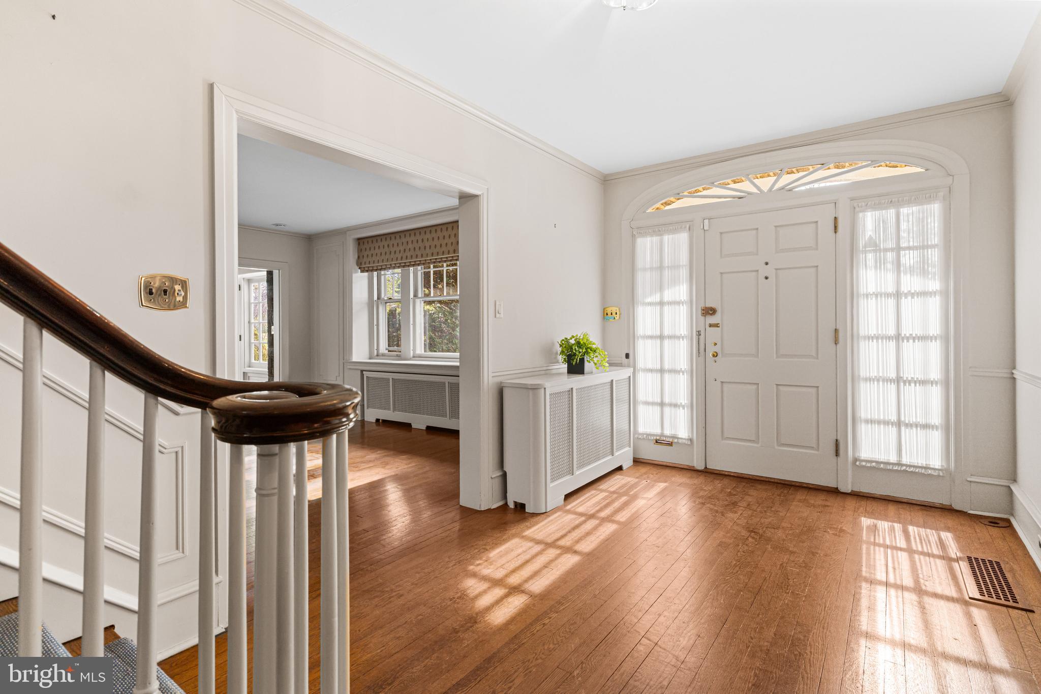 764 Glen Road Jenkintown, PA 19046 - Photo 5 of 57 a view of an entryway with wooden floor and windows