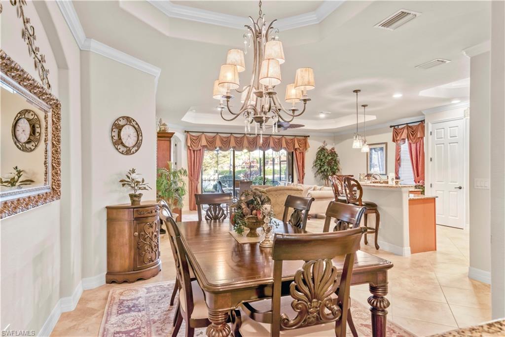 9446 Piacere Way Naples, FL 34113 - Photo 12 of 23 a view of a dining room with furniture window and outside view
