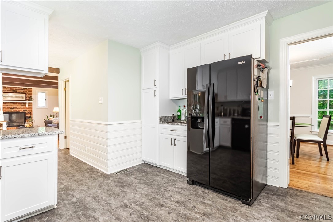 6 Staples Road Williamsburg, VA 23185 - Photo 16 of 37 a kitchen with a refrigerator and cabinets