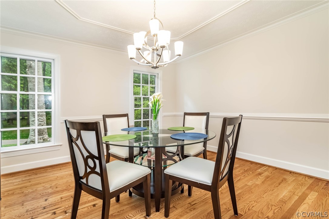 6 Staples Road Williamsburg, VA 23185 - Photo 18 of 37 a view of a dining room with furniture and a chandelier