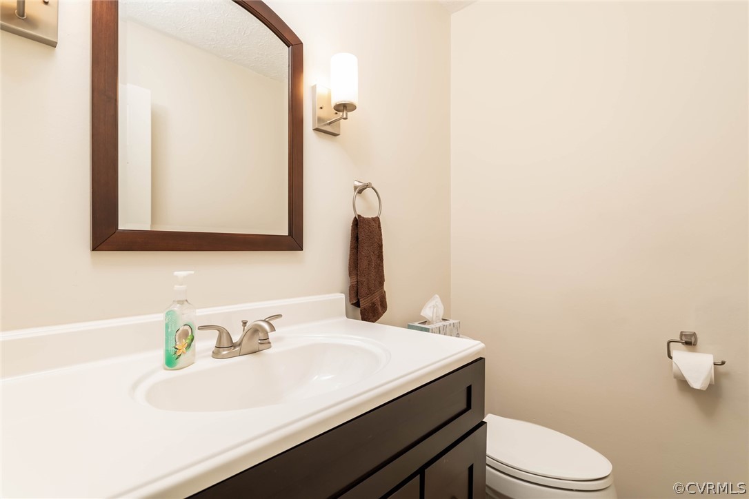 6 Staples Road Williamsburg, VA 23185 - Photo 19 of 37 a bathroom with a sink vanity mirror and toilet