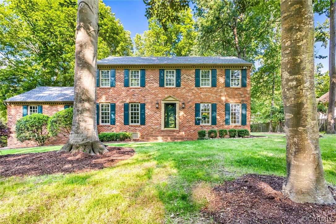 6 Staples Road Williamsburg, VA 23185 - Photo 2 of 37 a front view of a house with a yard