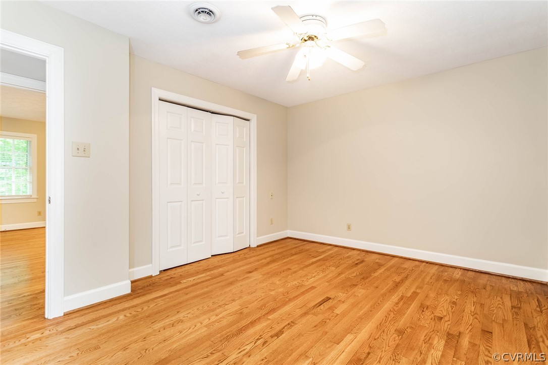 6 Staples Road Williamsburg, VA 23185 - Photo 21 of 37 a view of empty room with wooden floor