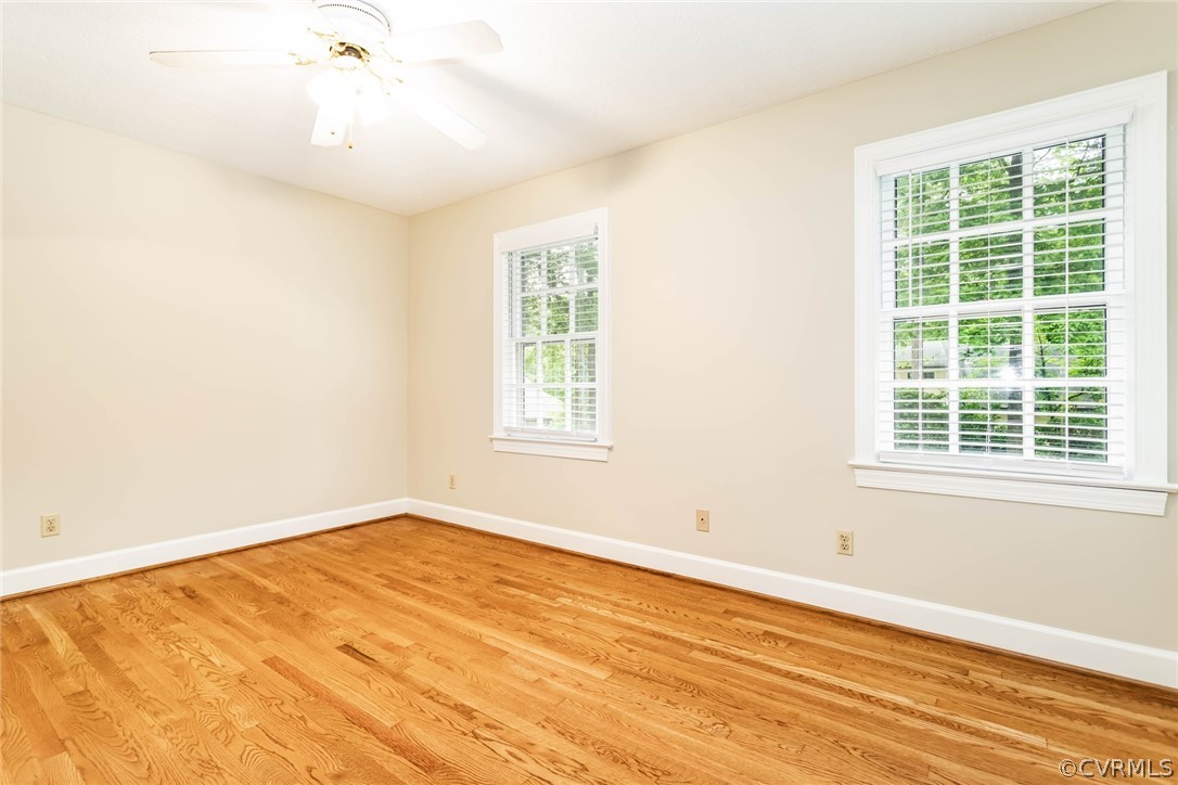 6 Staples Road Williamsburg, VA 23185 - Photo 22 of 37 an empty room with wooden floor and windows