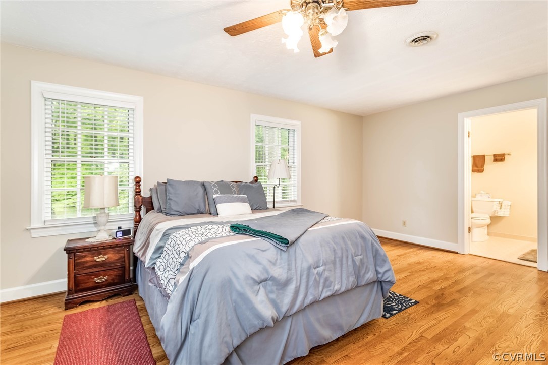 6 Staples Road Williamsburg, VA 23185 - Photo 27 of 37 a bed sitting in a bedroom next to a window