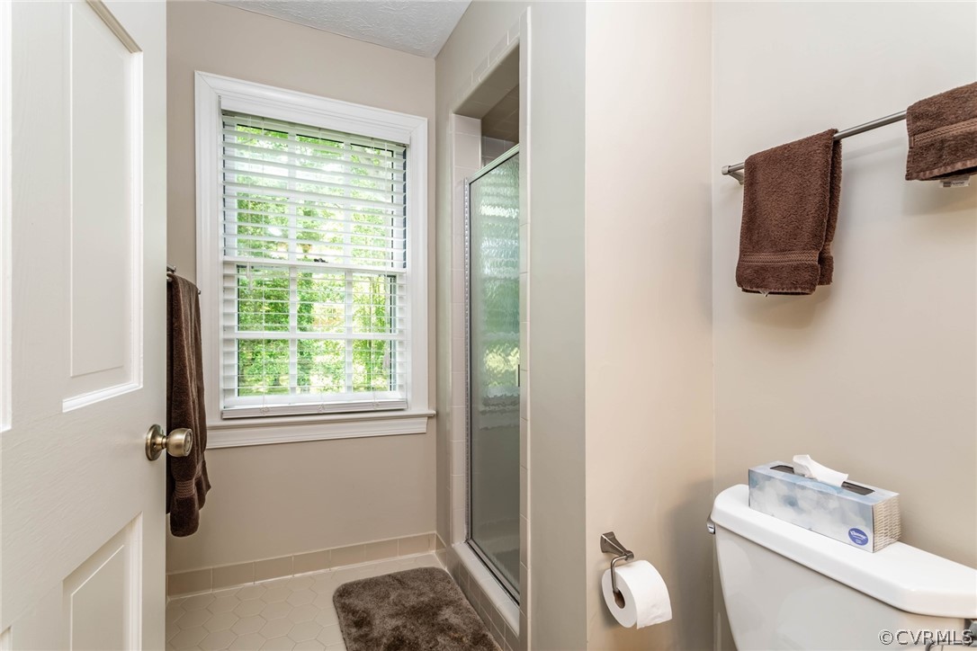 6 Staples Road Williamsburg, VA 23185 - Photo 28 of 37 a bathroom with a toilet and a shower curtain