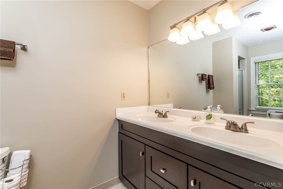 6 Staples Road Williamsburg, VA 23185 - Photo 29 of 37 a bathroom with a sink and a mirror