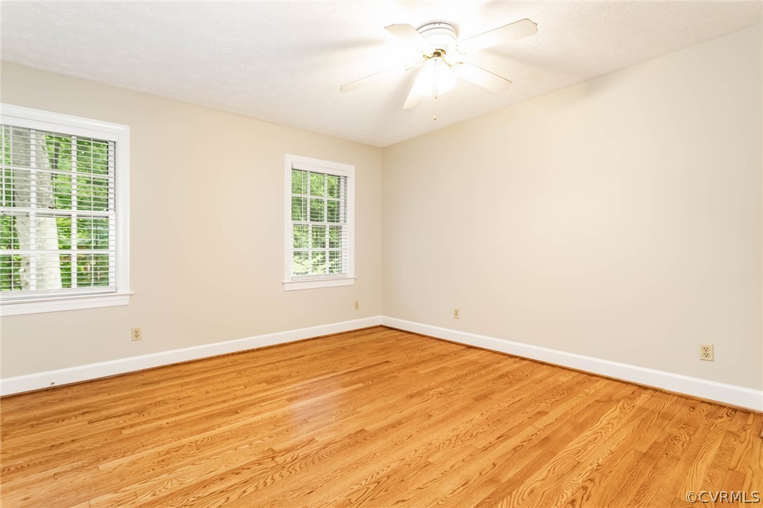 6 Staples Road Williamsburg, VA 23185 - Photo 31 of 37 an empty room with a window and a ceiling fan