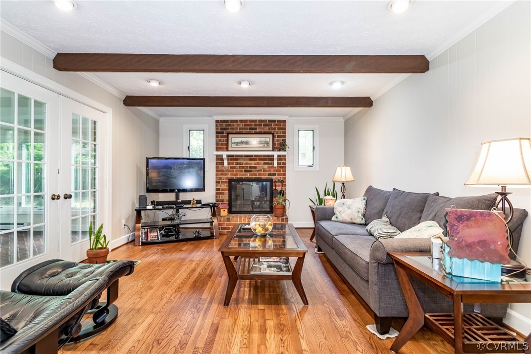 6 Staples Road Williamsburg, VA 23185 - Photo 6 of 37 a living room with fireplace furniture and a flat screen tv