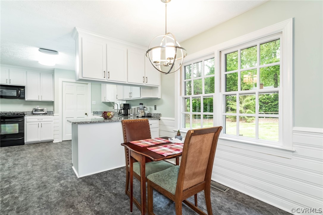 6 Staples Road Williamsburg, VA 23185 - Photo 9 of 37 a view of a dining room with furniture window and outside view