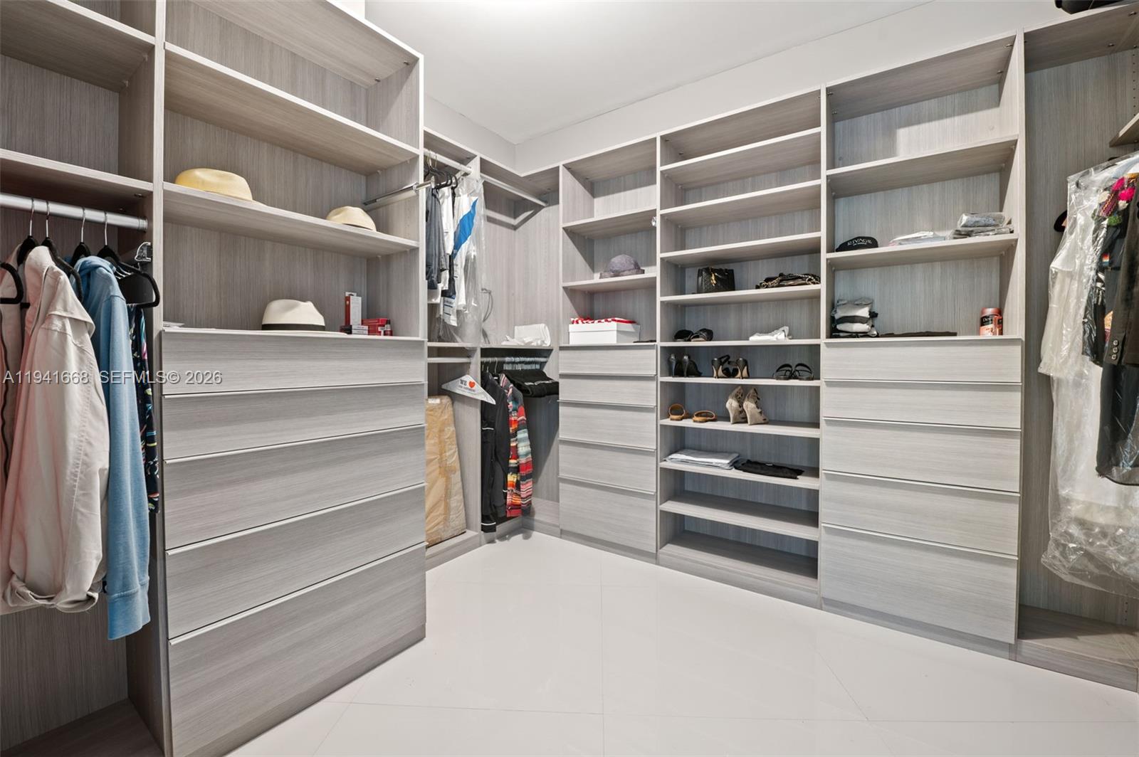 9601 Collins Avenue, Unit 908 Bal Harbour, FL 33154 - Photo 12 of 29 a view of walk in closet with empty racks